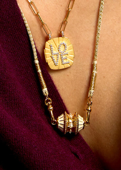 Collier talisman ivoire et doré Mya Bay