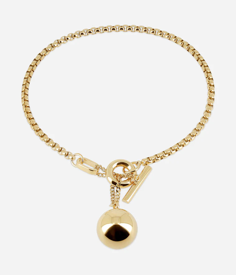 Collier Muse Zag doré fermoir T-bar boule pendante