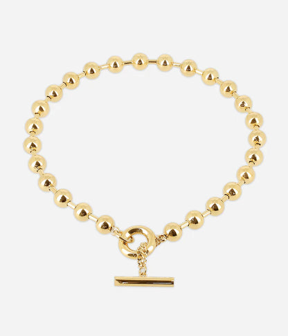 Collier Numa Zag perles dorées fermoir toggle barre