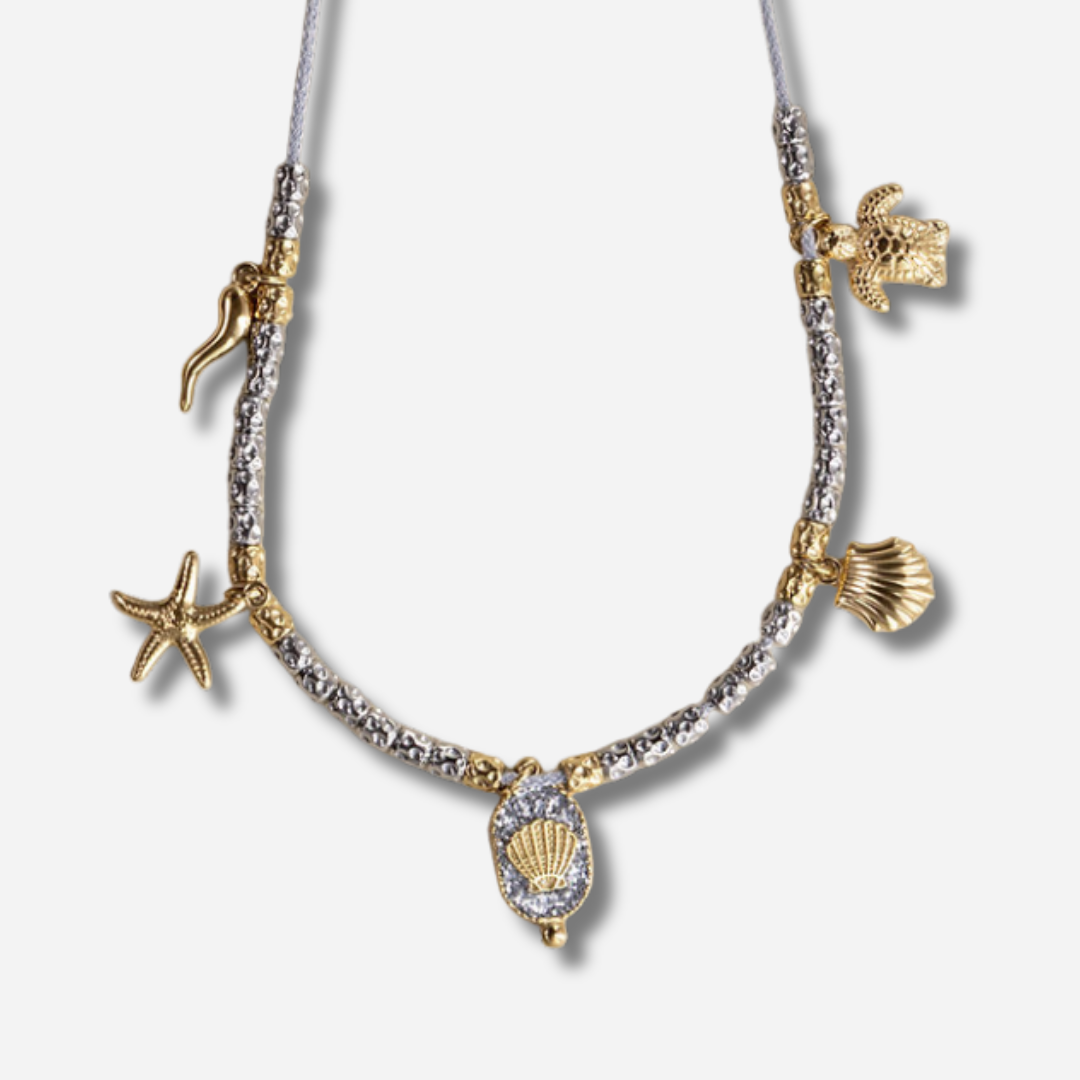 Collier Palombaggia Coquillage Argent Amadrina en acier doré 18K avec cristaux argentés, coquillage central et pampilles marines