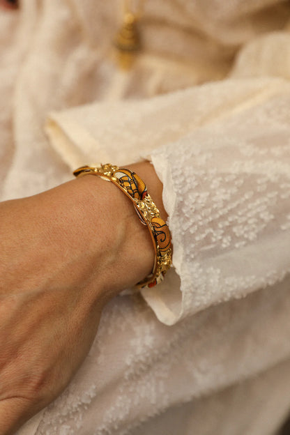 Bracelet manchette doree motif floral ajoure tendance femme