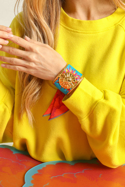Bijou manchette soleil doree accessoire symbolique lumineux
